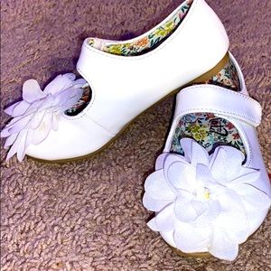Lightly-worn, all white, flower girl shoe.